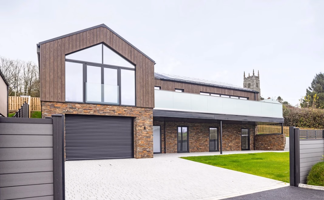 Exterior image of Devon new build house that features EasySeam Roof System.