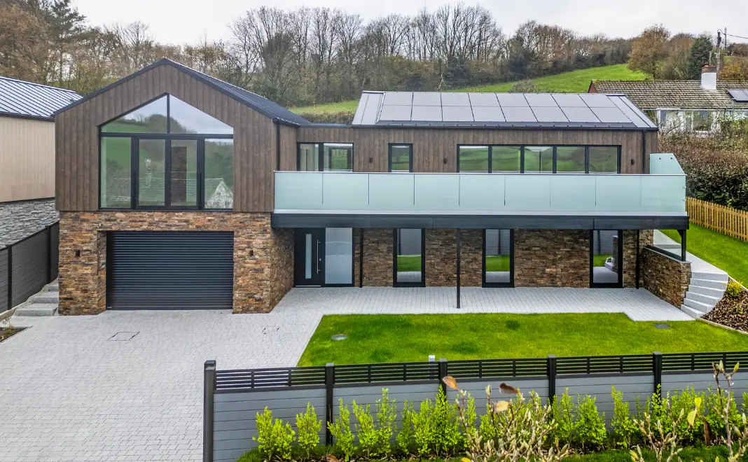 Exterior image of Devon new build house that features EasySeam Roof System.
