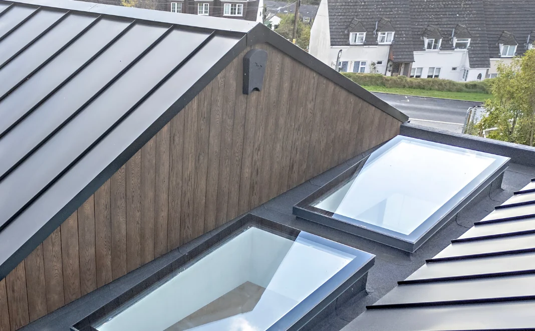 Exterior image of Devon new build house that features EasySeam Roof System.